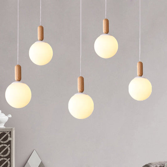 Sphere Kitchen Pendant Lighting White/Cognac Glass 1 Light Minimalist Hanging Lamp with Capsule Wood Grip White Clearhalo 'Ceiling Lights' 'Glass shade' 'Glass' 'Modern Pendants' 'Modern' 'Pendant Lights' 'Pendants' Lighting' 786695