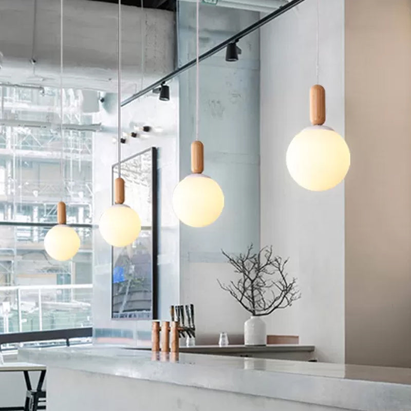 Sphere Kitchen Pendant Lighting White/Cognac Glass 1 Light Minimalist Hanging Lamp with Capsule Wood Grip Clearhalo 'Ceiling Lights' 'Glass shade' 'Glass' 'Modern Pendants' 'Modern' 'Pendant Lights' 'Pendants' Lighting' 786696