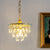 Tapered Faceted Crystal Hanging Light Modern 4 Bulbs Dining Room Ceiling Pendant Lamp in Gold Gold Clearhalo 'Ceiling Lights' 'Chandeliers' Lighting' options 787906_90c1a273-209a-4f77-bfe0-6b5efad4f46e