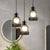 Iron Bottle Frame Cluster Pendant Industrial 3 Bulbs Dining Table Suspension Lighting with Mesh Bottom in Black Black Clearhalo 'Art Deco Pendants' 'Black' 'Cast Iron' 'Ceiling Lights' 'Ceramic' 'Crystal' 'Industrial Pendants' 'Industrial' 'Metal' 'Middle Century Pendants' 'Pendant Lights' 'Pendants' 'Rustic Pendants' 'Tiffany' Lighting' 791608