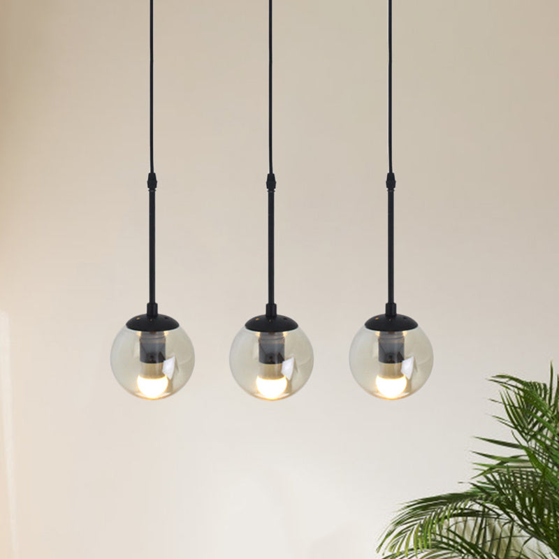 Clear Glass Black Cluster Pendant Light Globe 3/5/10 Heads Industrial Hanging Lamp Kit with Linear/Round Canopy 3 Black Linear Clearhalo 'Ceiling Lights' 'Chandeliers' 'Glass shade' 'Glass' 'Industrial Pendants' 'Industrial' 'Middle Century Pendants' 'Pendant Lights' 'Pendants' 'Tiffany' Lighting' 791755