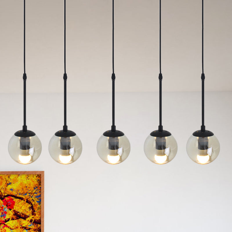 Clear Glass Black Cluster Pendant Light Globe 3/5/10 Heads Industrial Hanging Lamp Kit with Linear/Round Canopy 5 Black Linear Clearhalo 'Ceiling Lights' 'Chandeliers' 'Glass shade' 'Glass' 'Industrial Pendants' 'Industrial' 'Middle Century Pendants' 'Pendant Lights' 'Pendants' 'Tiffany' Lighting' 791759