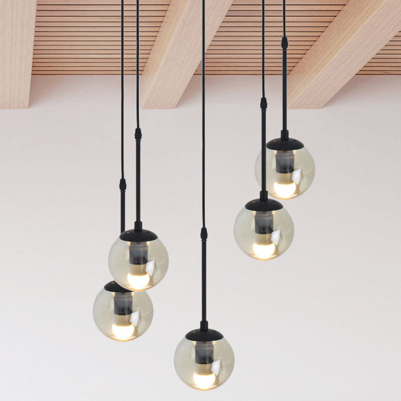 Clear Glass Black Cluster Pendant Light Globe 3/5/10 Heads Industrial Hanging Lamp Kit with Linear/Round Canopy 5 Black Round Clearhalo 'Ceiling Lights' 'Chandeliers' 'Glass shade' 'Glass' 'Industrial Pendants' 'Industrial' 'Middle Century Pendants' 'Pendant Lights' 'Pendants' 'Tiffany' Lighting' 791769