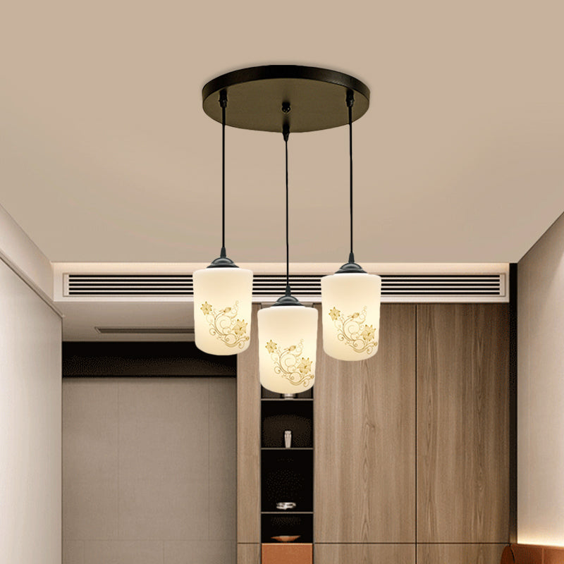 Cylinder Dining Room Multi Ceiling Light Modern White Printed Glass 3-Head Black Hanging Pendant with Linear/Round Canopy Clearhalo 'Ceiling Lights' 'Glass shade' 'Glass' 'Pendant Lights' 'Pendants' Lighting' 802002