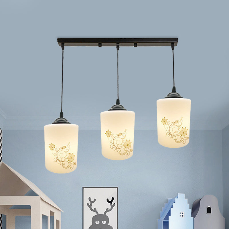Cylinder Dining Room Multi Ceiling Light Modern White Printed Glass 3-Head Black Hanging Pendant with Linear/Round Canopy Clearhalo 'Ceiling Lights' 'Glass shade' 'Glass' 'Pendant Lights' 'Pendants' Lighting' 802014