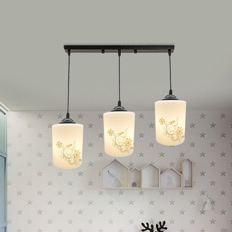 Cylinder Dining Room Multi Ceiling Light Modern White Printed Glass 3-Head Black Hanging Pendant with Linear/Round Canopy Clearhalo 'Ceiling Lights' 'Glass shade' 'Glass' 'Pendant Lights' 'Pendants' Lighting' 802015