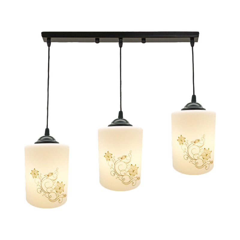 Cylinder Dining Room Multi Ceiling Light Modern White Printed Glass 3-Head Black Hanging Pendant with Linear/Round Canopy Clearhalo 'Ceiling Lights' 'Glass shade' 'Glass' 'Pendant Lights' 'Pendants' Lighting' 802016