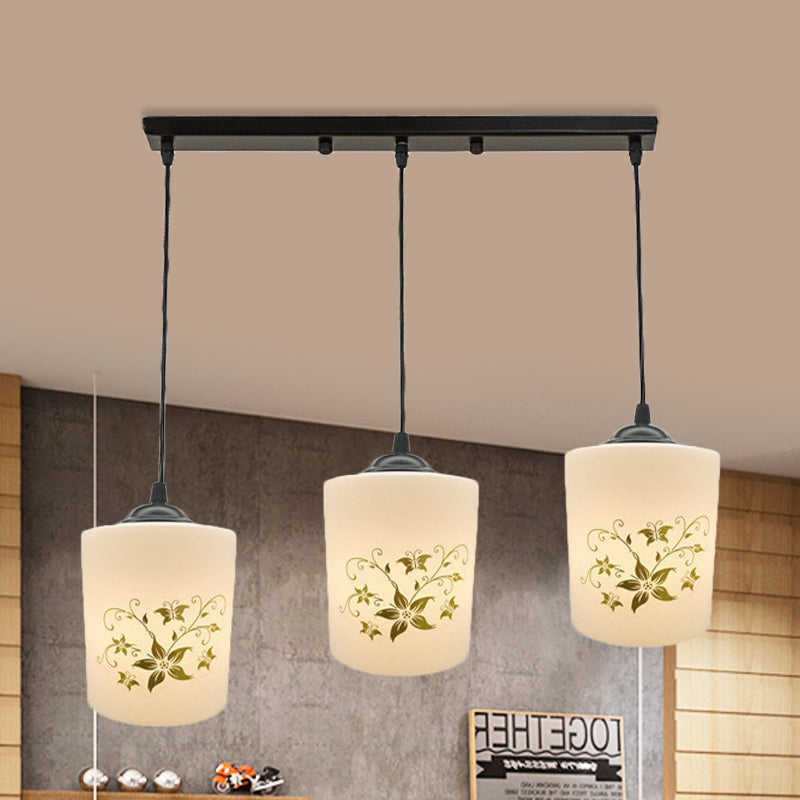 Cylinder Dining Room Multi Ceiling Light Modern White Printed Glass 3-Head Black Hanging Pendant with Linear/Round Canopy White B Linear Clearhalo 'Ceiling Lights' 'Glass shade' 'Glass' 'Pendant Lights' 'Pendants' Lighting' 802018