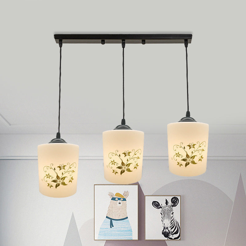 Cylinder Dining Room Multi Ceiling Light Modern White Printed Glass 3-Head Black Hanging Pendant with Linear/Round Canopy Clearhalo 'Ceiling Lights' 'Glass shade' 'Glass' 'Pendant Lights' 'Pendants' Lighting' 802019