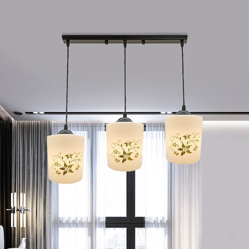 Cylinder Dining Room Multi Ceiling Light Modern White Printed Glass 3-Head Black Hanging Pendant with Linear/Round Canopy Clearhalo 'Ceiling Lights' 'Glass shade' 'Glass' 'Pendant Lights' 'Pendants' Lighting' 802020