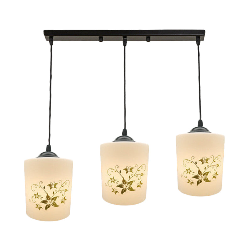 Cylinder Dining Room Multi Ceiling Light Modern White Printed Glass 3-Head Black Hanging Pendant with Linear/Round Canopy Clearhalo 'Ceiling Lights' 'Glass shade' 'Glass' 'Pendant Lights' 'Pendants' Lighting' 802021