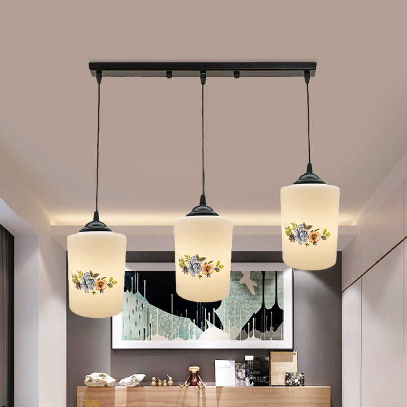 Cylinder Dining Room Multi Ceiling Light Modern White Printed Glass 3-Head Black Hanging Pendant with Linear/Round Canopy Clearhalo 'Ceiling Lights' 'Glass shade' 'Glass' 'Pendant Lights' 'Pendants' Lighting' 802023