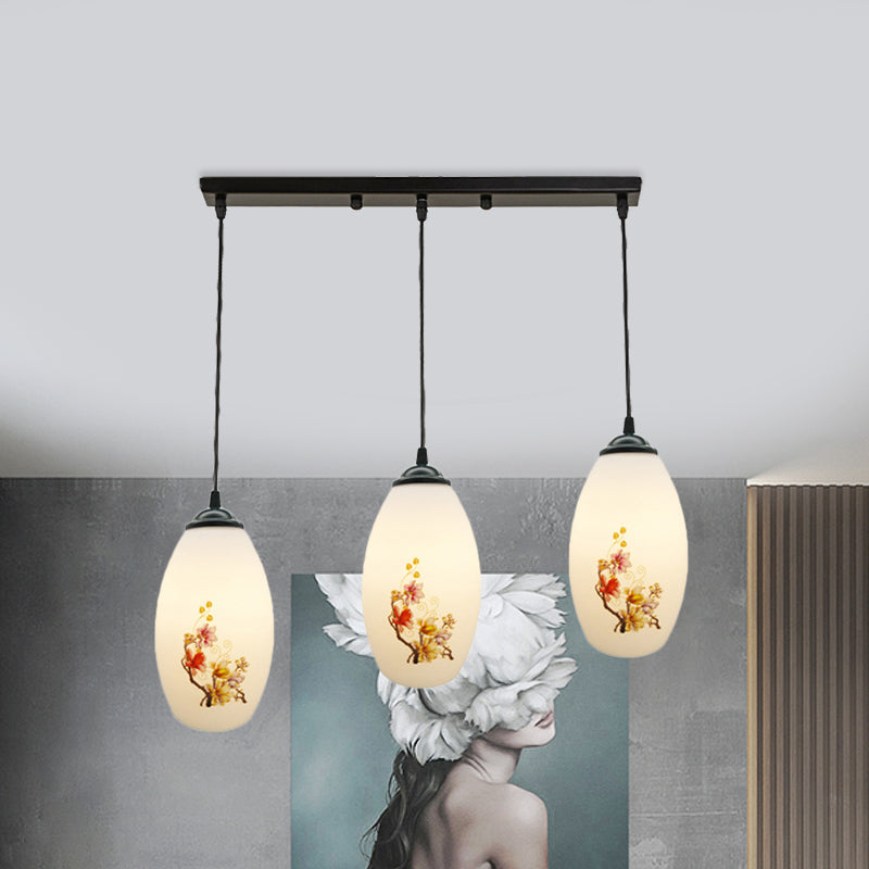 3 Bulbs Multiple Hanging Light Modern Oblong Frosted White Glass Linear/Round Canopy Pendulum Lamp with Flower Pattern Clearhalo 'Ceiling Lights' 'Glass shade' 'Glass' 'Pendant Lights' 'Pendants' Lighting' 802076