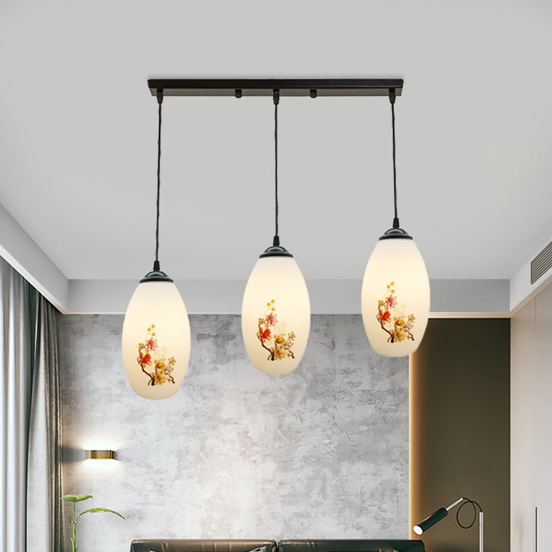 3 Bulbs Multiple Hanging Light Modern Oblong Frosted White Glass Linear/Round Canopy Pendulum Lamp with Flower Pattern Clearhalo 'Ceiling Lights' 'Glass shade' 'Glass' 'Pendant Lights' 'Pendants' Lighting' 802077