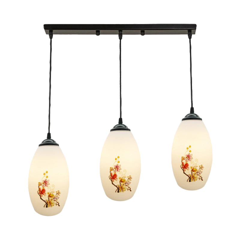 3 Bulbs Multiple Hanging Light Modern Oblong Frosted White Glass Linear/Round Canopy Pendulum Lamp with Flower Pattern Clearhalo 'Ceiling Lights' 'Glass shade' 'Glass' 'Pendant Lights' 'Pendants' Lighting' 802078