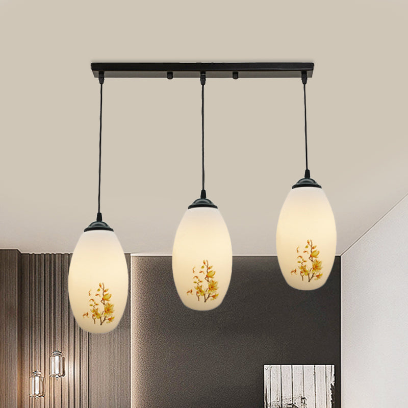 3 Bulbs Multiple Hanging Light Modern Oblong Frosted White Glass Linear/Round Canopy Pendulum Lamp with Flower Pattern Clearhalo 'Ceiling Lights' 'Glass shade' 'Glass' 'Pendant Lights' 'Pendants' Lighting' 802085
