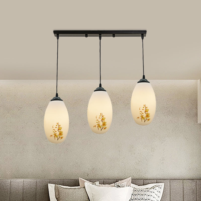 3 Bulbs Multiple Hanging Light Modern Oblong Frosted White Glass Linear/Round Canopy Pendulum Lamp with Flower Pattern Clearhalo 'Ceiling Lights' 'Glass shade' 'Glass' 'Pendant Lights' 'Pendants' Lighting' 802086