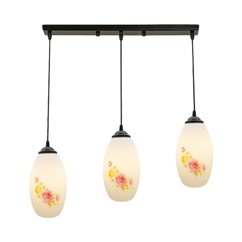 3 Bulbs Multiple Hanging Light Modern Oblong Frosted White Glass Linear/Round Canopy Pendulum Lamp with Flower Pattern Clearhalo 'Ceiling Lights' 'Glass shade' 'Glass' 'Pendant Lights' 'Pendants' Lighting' 802091
