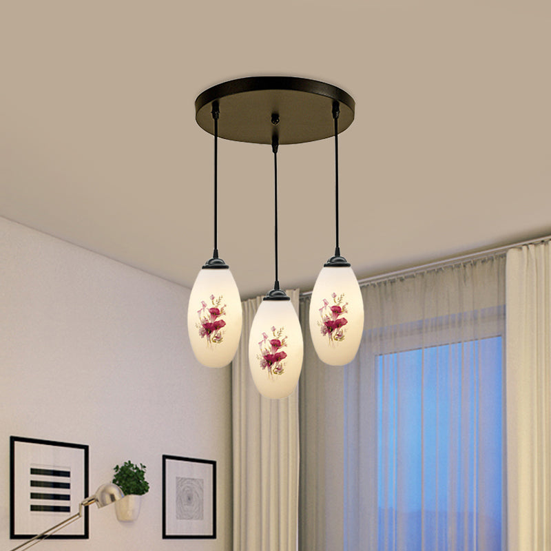 3 Lights Oval Multi-Pendant Modern Black Finish White Printed Glass Ceiling Hang Fixture with Round/Linear Canopy Clearhalo 'Ceiling Lights' 'Close To Ceiling Lights' 'Glass shade' 'Glass' 'Pendant Lights' 'Pendants' Lighting' 802118