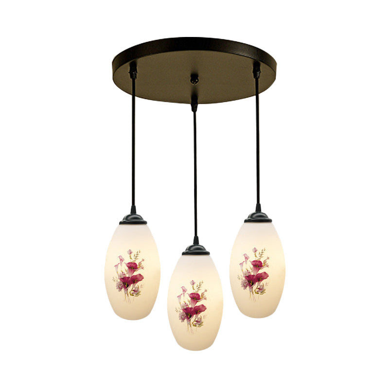 3 Lights Oval Multi-Pendant Modern Black Finish White Printed Glass Ceiling Hang Fixture with Round/Linear Canopy Clearhalo 'Ceiling Lights' 'Close To Ceiling Lights' 'Glass shade' 'Glass' 'Pendant Lights' 'Pendants' Lighting' 802119