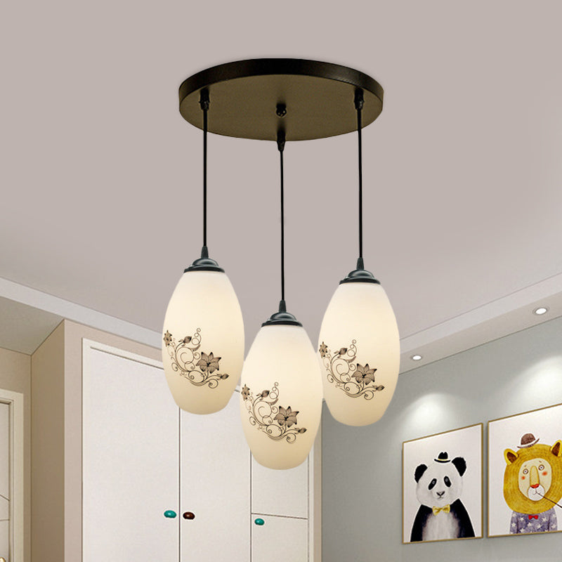 3 Lights Oval Multi-Pendant Modern Black Finish White Printed Glass Ceiling Hang Fixture with Round/Linear Canopy White B Round Clearhalo 'Ceiling Lights' 'Close To Ceiling Lights' 'Glass shade' 'Glass' 'Pendant Lights' 'Pendants' Lighting' 802121