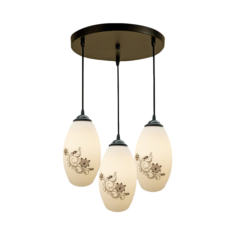 3 Lights Oval Multi-Pendant Modern Black Finish White Printed Glass Ceiling Hang Fixture with Round/Linear Canopy Clearhalo 'Ceiling Lights' 'Close To Ceiling Lights' 'Glass shade' 'Glass' 'Pendant Lights' 'Pendants' Lighting' 802124