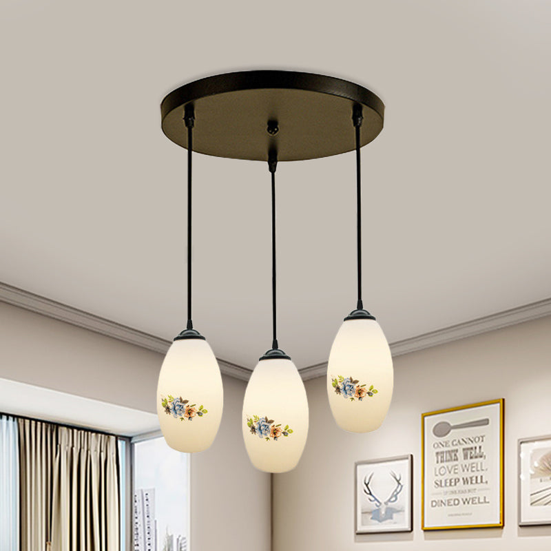 3 Lights Oval Multi-Pendant Modern Black Finish White Printed Glass Ceiling Hang Fixture with Round/Linear Canopy White A Round Clearhalo 'Ceiling Lights' 'Close To Ceiling Lights' 'Glass shade' 'Glass' 'Pendant Lights' 'Pendants' Lighting' 802125