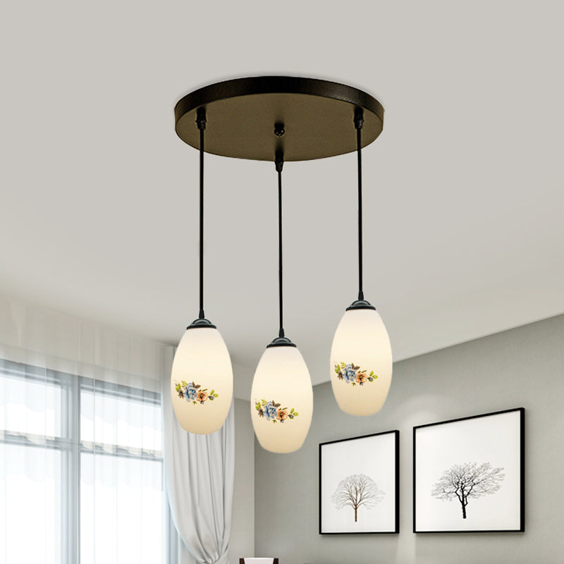 3 Lights Oval Multi-Pendant Modern Black Finish White Printed Glass Ceiling Hang Fixture with Round/Linear Canopy Clearhalo 'Ceiling Lights' 'Close To Ceiling Lights' 'Glass shade' 'Glass' 'Pendant Lights' 'Pendants' Lighting' 802126