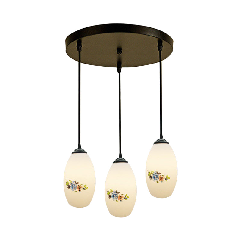 3 Lights Oval Multi-Pendant Modern Black Finish White Printed Glass Ceiling Hang Fixture with Round/Linear Canopy Clearhalo 'Ceiling Lights' 'Close To Ceiling Lights' 'Glass shade' 'Glass' 'Pendant Lights' 'Pendants' Lighting' 802128