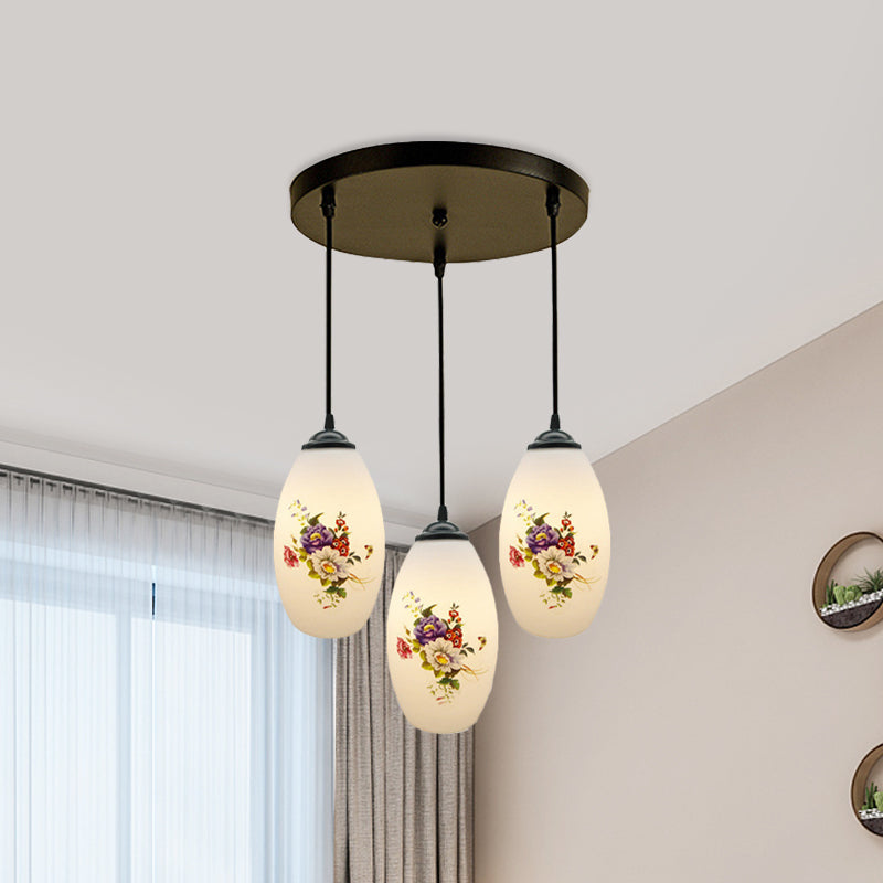 3 Lights Oval Multi-Pendant Modern Black Finish White Printed Glass Ceiling Hang Fixture with Round/Linear Canopy Clearhalo 'Ceiling Lights' 'Close To Ceiling Lights' 'Glass shade' 'Glass' 'Pendant Lights' 'Pendants' Lighting' 802130