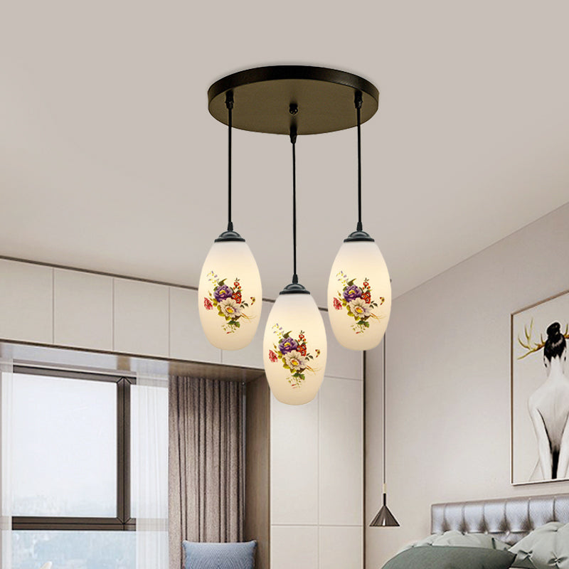 3 Lights Oval Multi-Pendant Modern Black Finish White Printed Glass Ceiling Hang Fixture with Round/Linear Canopy Clearhalo 'Ceiling Lights' 'Close To Ceiling Lights' 'Glass shade' 'Glass' 'Pendant Lights' 'Pendants' Lighting' 802131