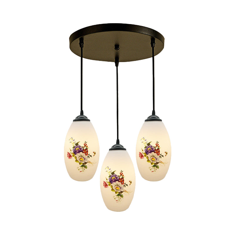 3 Lights Oval Multi-Pendant Modern Black Finish White Printed Glass Ceiling Hang Fixture with Round/Linear Canopy Clearhalo 'Ceiling Lights' 'Close To Ceiling Lights' 'Glass shade' 'Glass' 'Pendant Lights' 'Pendants' Lighting' 802132