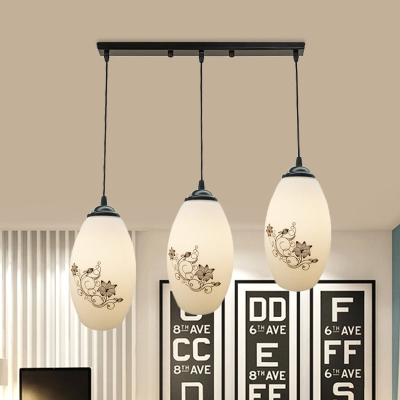 3 Lights Oval Multi-Pendant Modern Black Finish White Printed Glass Ceiling Hang Fixture with Round/Linear Canopy White B Linear Clearhalo 'Ceiling Lights' 'Close To Ceiling Lights' 'Glass shade' 'Glass' 'Pendant Lights' 'Pendants' Lighting' 802138