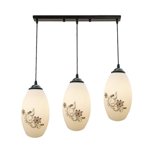 3 Lights Oval Multi-Pendant Modern Black Finish White Printed Glass Ceiling Hang Fixture with Round/Linear Canopy Clearhalo 'Ceiling Lights' 'Close To Ceiling Lights' 'Glass shade' 'Glass' 'Pendant Lights' 'Pendants' Lighting' 802141