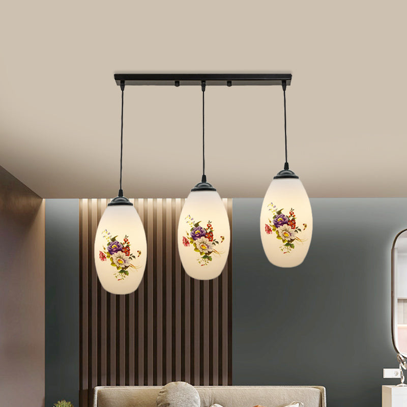 3 Lights Oval Multi-Pendant Modern Black Finish White Printed Glass Ceiling Hang Fixture with Round/Linear Canopy Clearhalo 'Ceiling Lights' 'Close To Ceiling Lights' 'Glass shade' 'Glass' 'Pendant Lights' 'Pendants' Lighting' 802148