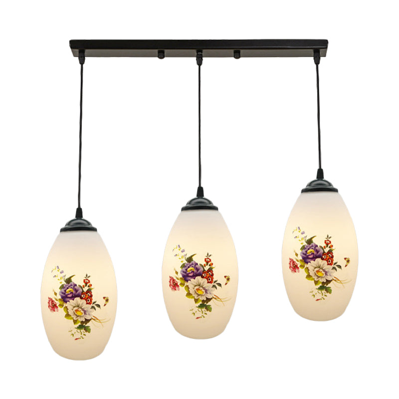 3 Lights Oval Multi-Pendant Modern Black Finish White Printed Glass Ceiling Hang Fixture with Round/Linear Canopy Clearhalo 'Ceiling Lights' 'Close To Ceiling Lights' 'Glass shade' 'Glass' 'Pendant Lights' 'Pendants' Lighting' 802149