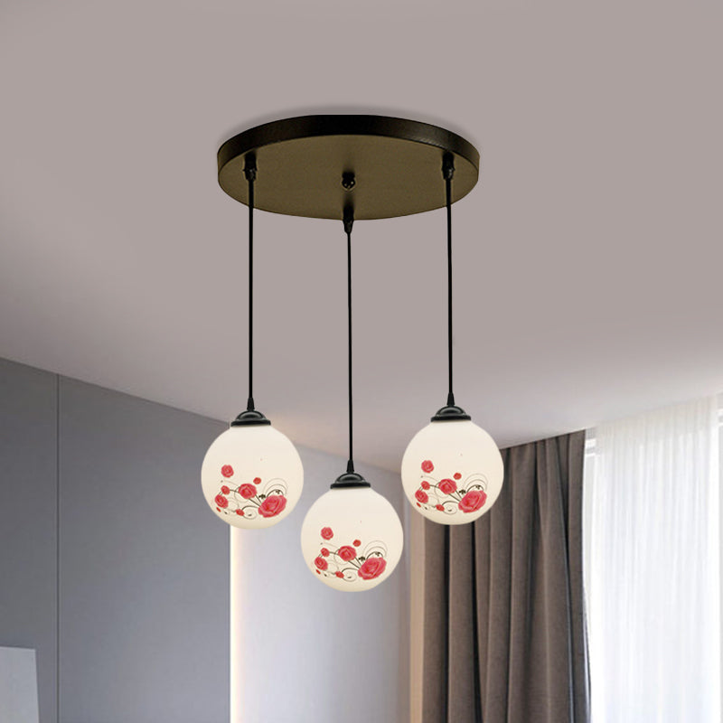 3 Heads Orb Multi-Pendant Modernism Black Finish White Frosted Glass Hanging Light Kit with Flower Pattern and Round/Linear Canopy White C Round Clearhalo 'Ceiling Lights' 'Glass shade' 'Glass' 'Pendant Lights' 'Pendants' Lighting' 802254