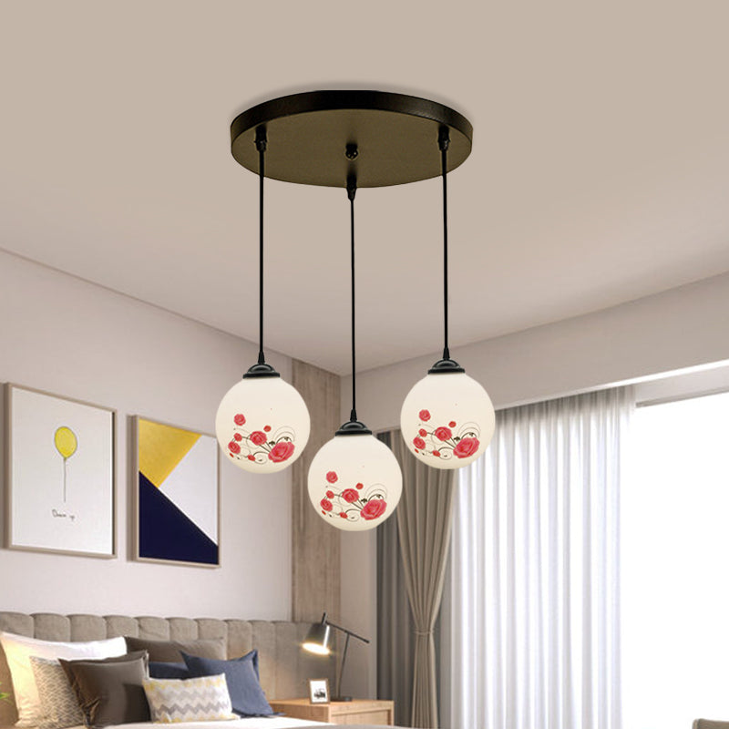 3 Heads Orb Multi-Pendant Modernism Black Finish White Frosted Glass Hanging Light Kit with Flower Pattern and Round/Linear Canopy Clearhalo 'Ceiling Lights' 'Glass shade' 'Glass' 'Pendant Lights' 'Pendants' Lighting' 802255