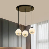 3 Heads Orb Multi-Pendant Modernism Black Finish White Frosted Glass Hanging Light Kit with Flower Pattern and Round/Linear Canopy Clearhalo 'Ceiling Lights' 'Glass shade' 'Glass' 'Pendant Lights' 'Pendants' Lighting' 802263