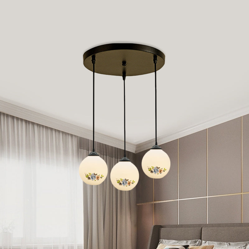 3 Heads Orb Multi-Pendant Modernism Black Finish White Frosted Glass Hanging Light Kit with Flower Pattern and Round/Linear Canopy Clearhalo 'Ceiling Lights' 'Glass shade' 'Glass' 'Pendant Lights' 'Pendants' Lighting' 802264