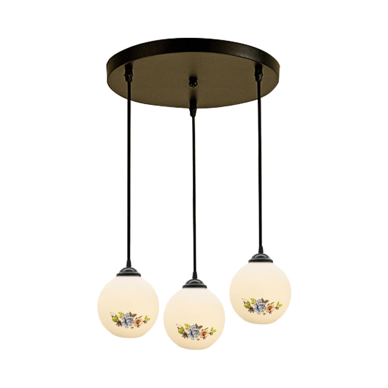 3 Heads Orb Multi-Pendant Modernism Black Finish White Frosted Glass Hanging Light Kit with Flower Pattern and Round/Linear Canopy Clearhalo 'Ceiling Lights' 'Glass shade' 'Glass' 'Pendant Lights' 'Pendants' Lighting' 802265