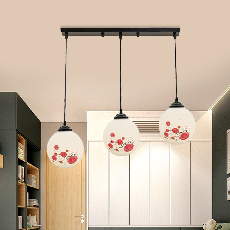 3 Heads Orb Multi-Pendant Modernism Black Finish White Frosted Glass Hanging Light Kit with Flower Pattern and Round/Linear Canopy Clearhalo 'Ceiling Lights' 'Glass shade' 'Glass' 'Pendant Lights' 'Pendants' Lighting' 802267