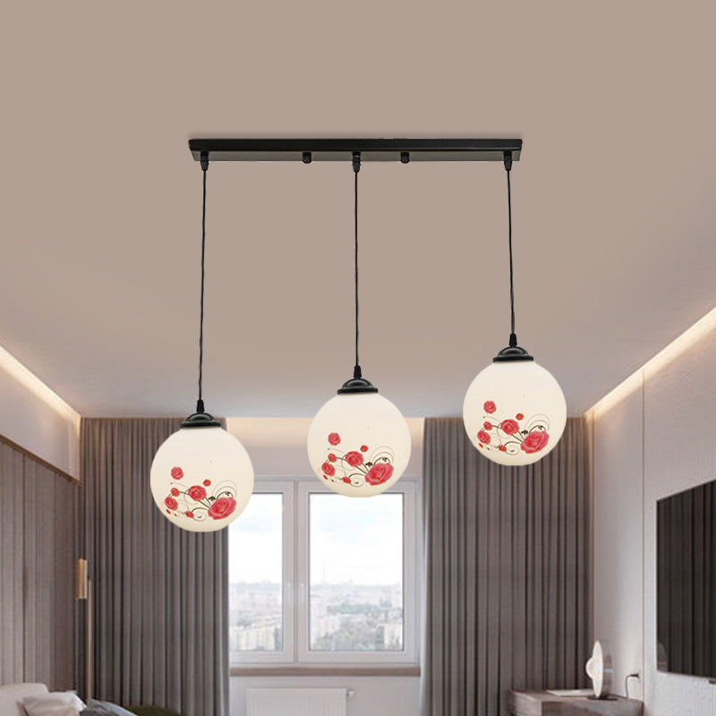 3 Heads Orb Multi-Pendant Modernism Black Finish White Frosted Glass Hanging Light Kit with Flower Pattern and Round/Linear Canopy Clearhalo 'Ceiling Lights' 'Glass shade' 'Glass' 'Pendant Lights' 'Pendants' Lighting' 802268