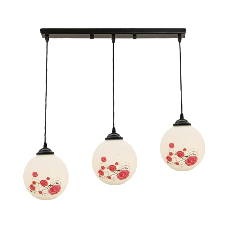 3 Heads Orb Multi-Pendant Modernism Black Finish White Frosted Glass Hanging Light Kit with Flower Pattern and Round/Linear Canopy Clearhalo 'Ceiling Lights' 'Glass shade' 'Glass' 'Pendant Lights' 'Pendants' Lighting' 802269