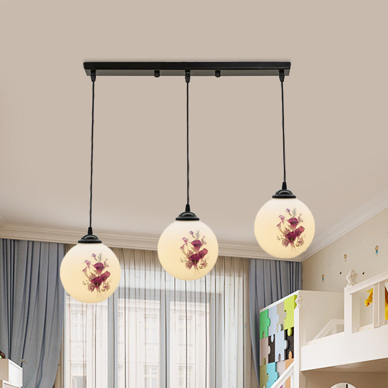 3 Heads Orb Multi-Pendant Modernism Black Finish White Frosted Glass Hanging Light Kit with Flower Pattern and Round/Linear Canopy Clearhalo 'Ceiling Lights' 'Glass shade' 'Glass' 'Pendant Lights' 'Pendants' Lighting' 802272