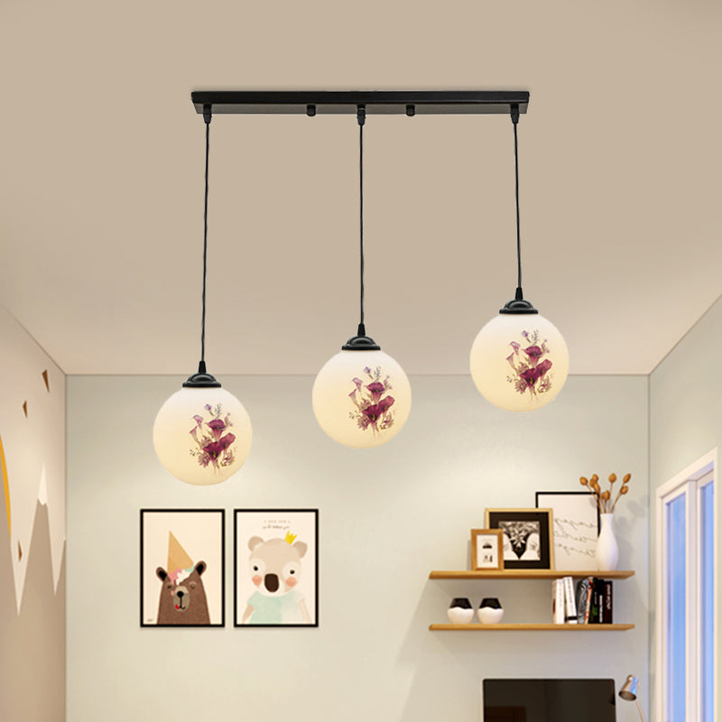 3 Heads Orb Multi-Pendant Modernism Black Finish White Frosted Glass Hanging Light Kit with Flower Pattern and Round/Linear Canopy Clearhalo 'Ceiling Lights' 'Glass shade' 'Glass' 'Pendant Lights' 'Pendants' Lighting' 802273