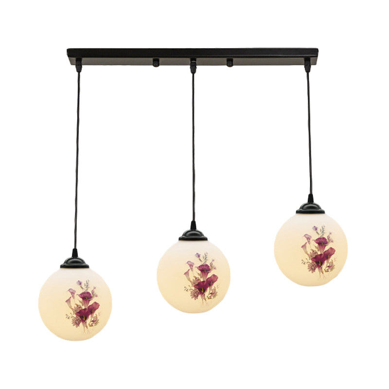 3 Heads Orb Multi-Pendant Modernism Black Finish White Frosted Glass Hanging Light Kit with Flower Pattern and Round/Linear Canopy Clearhalo 'Ceiling Lights' 'Glass shade' 'Glass' 'Pendant Lights' 'Pendants' Lighting' 802274