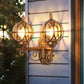 Black/Bronze Spherical Wall Lighting Ideas Country Amber Glass 2-Bulb Patio Surface Wall Sconce with Cage Bronze Clearhalo 'Wall Lamps & Sconces' 'Wall Lights' Lighting' 815074