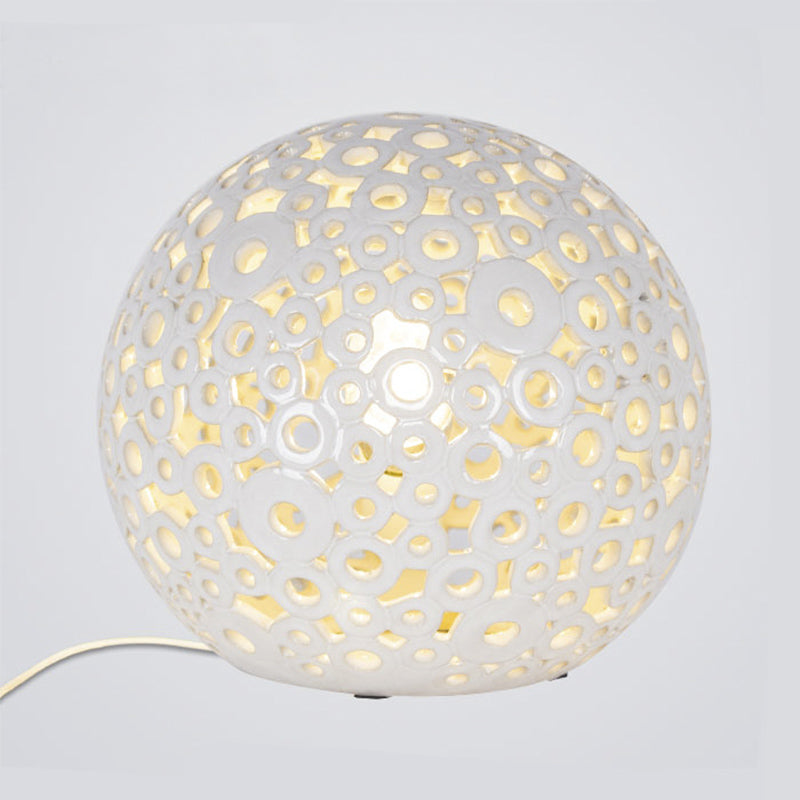 White Hollow-Out Globe Table Light Modernism 1-Head Ceramics Night Lamp for Bedroom Clearhalo 'Lamps' 'Table Lamps' Lighting' 815358