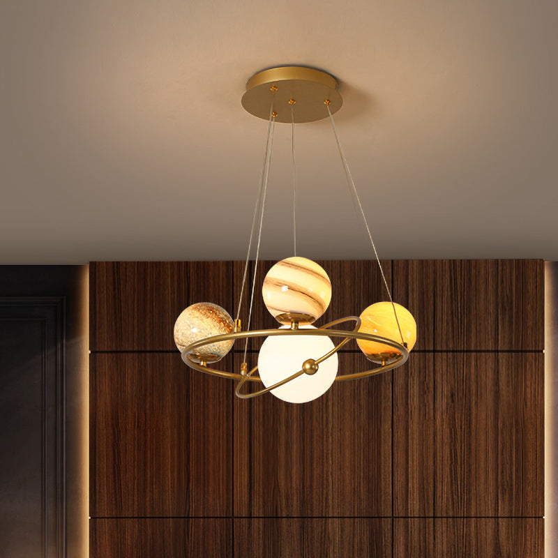 Kids Solar System Ceiling Pendant Light Stained Glass 4/6-Head Bedroom Chandelier Lighting in Gold 4 Gold Clearhalo 'Ceiling Lights' 'Chandeliers' Lighting' options 818549_f17beadd-e334-4ef1-a6a8-65ba2763d54a